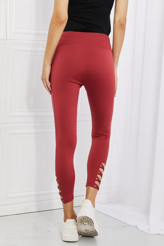 Yelete Ready For Action Full Size Ankle Cutout Active Leggings in Brick Red - pvmark